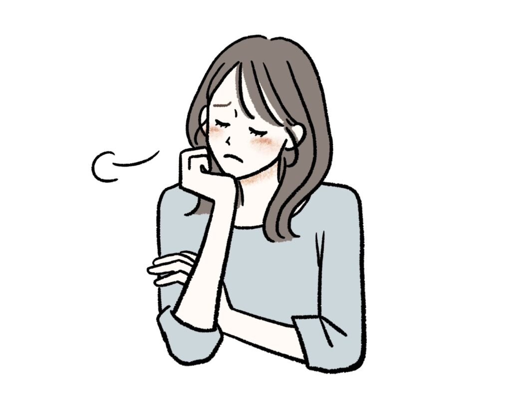 溜息をつく女性